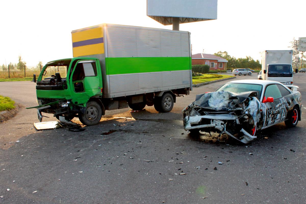 truck accident involving a box truck and a passenger car